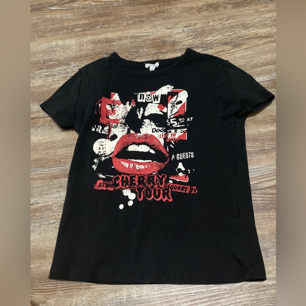 I’m selling a black crop top from garage it’s black and  a little red and white